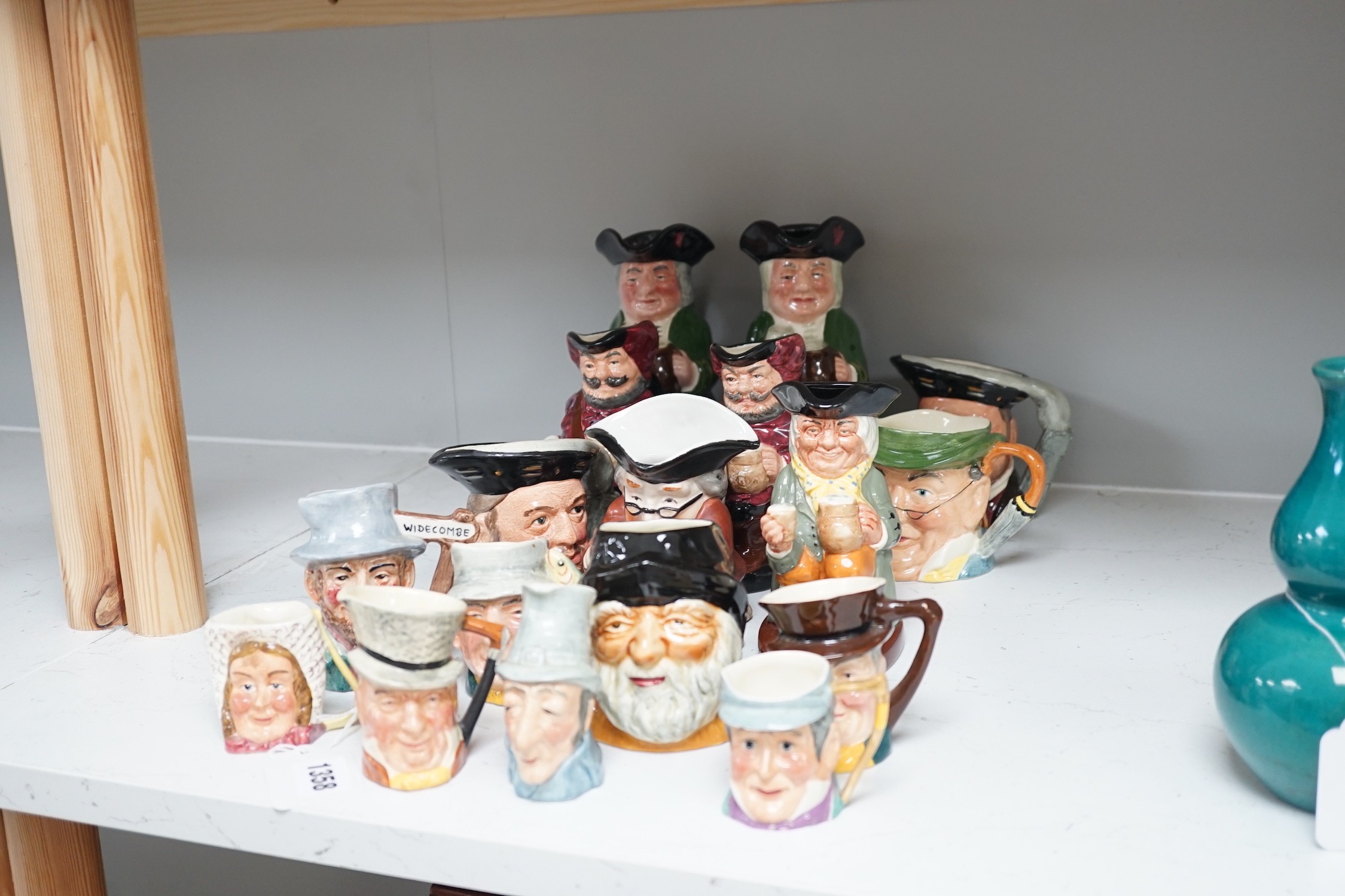 Five Royal Doulton toby jugs and a collection of similar toby jugs